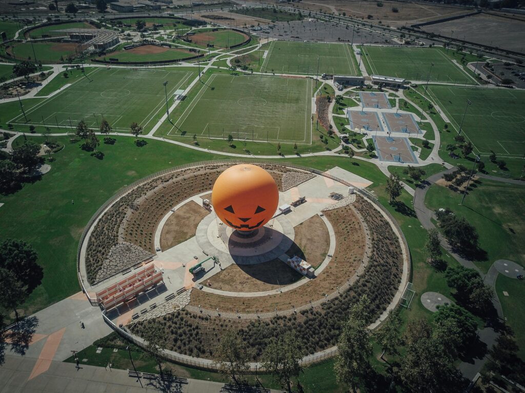 Aerial view of the iconic Great Park Balloon in Irvine, California, surrounded by greenery.
